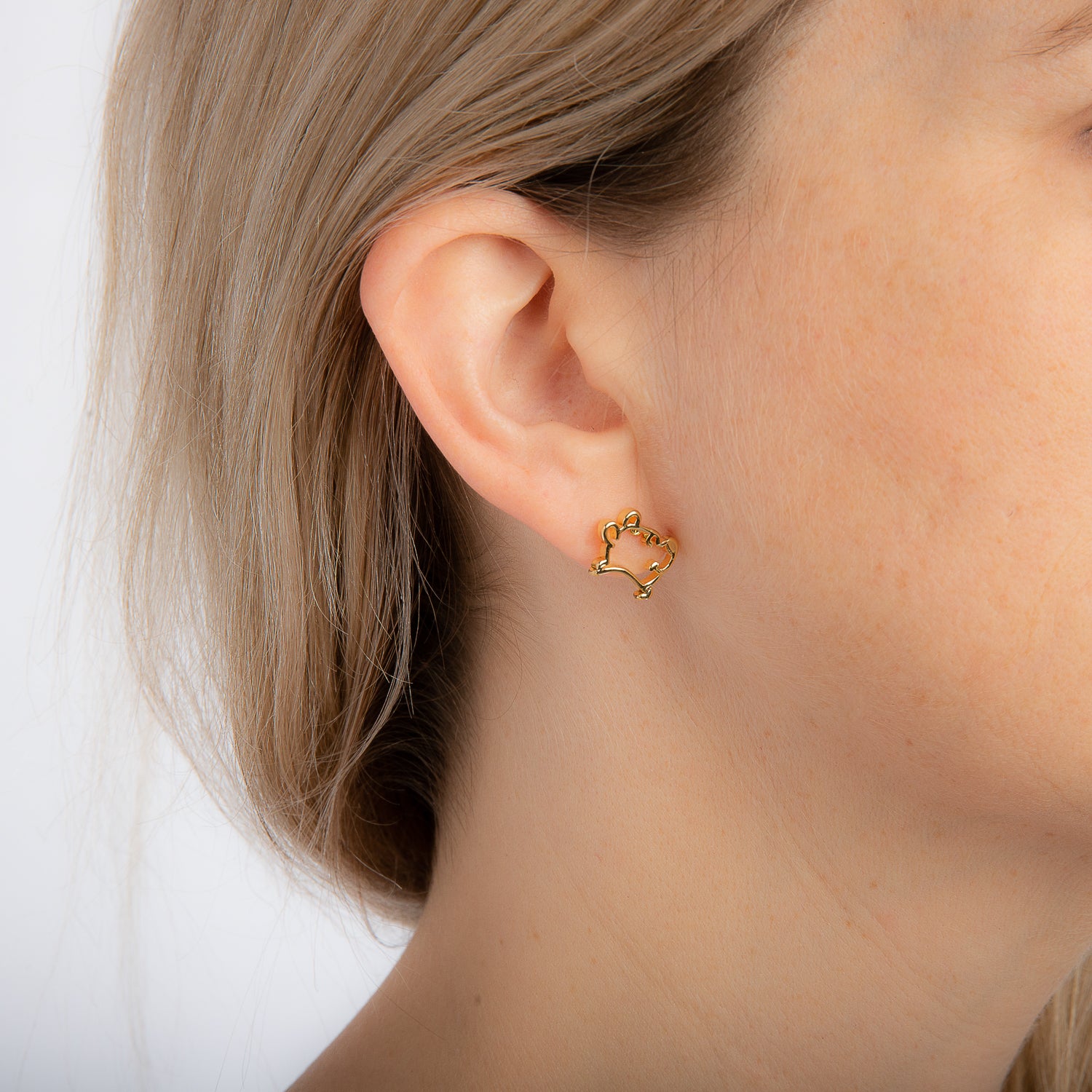 Disney_Couture_Kingdom_Winnie_the_Pooh_earrings_on_model